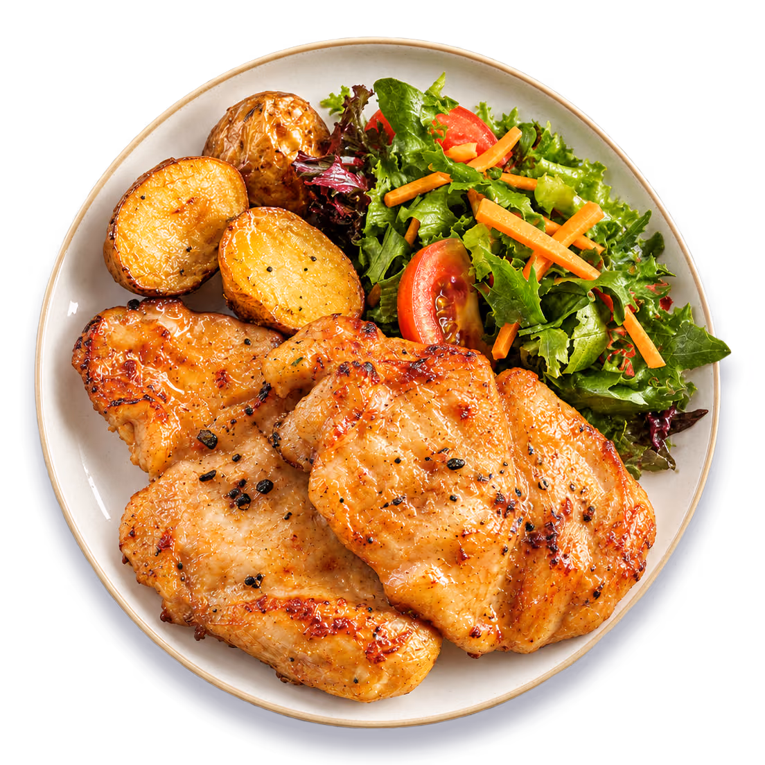 Plato con filetes de muslo de pollo dorados, papas y ensalada